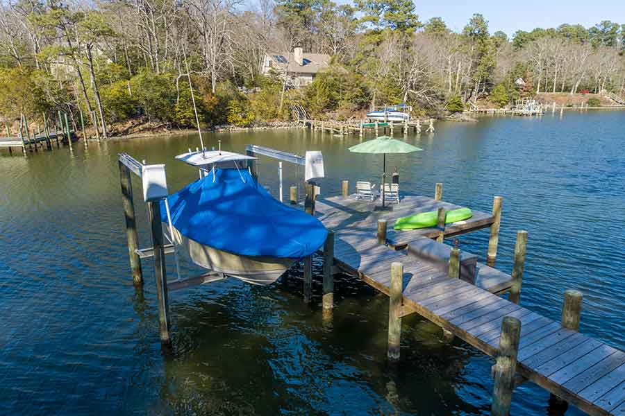 Protected pier with boat lift at Moore's Creek